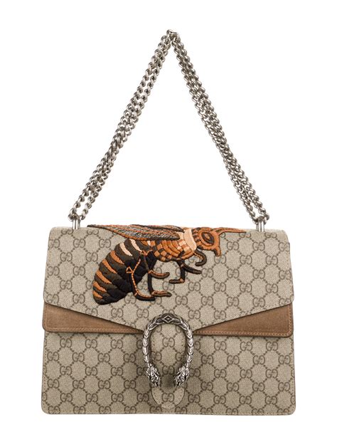 gucci top with bees on shoulder|Gucci handbags.